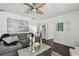 Cozy living room with hardwood floors, a gray sofa, and plenty of natural light at 670 Wooddell Dr, Safety Harbor, FL 34695