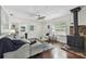 Comfortable living room showcasing wood floors, a modern fireplace, and soothing decor at 670 Wooddell Dr, Safety Harbor, FL 34695