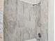 Updated shower features modern tile and sleek fixtures at 670 Wooddell Dr, Safety Harbor, FL 34695
