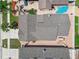 Aerial view of the home showcasing the roof, backyard patio, and surrounding landscape at 7004 Westminster St, Tampa, FL 33635