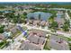 This aerial view captures the essence of community living with a lake view and mature greenery at 7004 Westminster St, Tampa, FL 33635