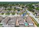 An aerial view highlights the layout with a patio and a private pool at 7004 Westminster St, Tampa, FL 33635