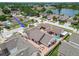A paver patio and lush landscaping create a private retreat in this charming home's backyard at 7004 Westminster St, Tampa, FL 33635