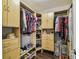 Well-organized walk-in closet with custom shelving, hanging rods, and ample storage for clothing and accessories at 7004 Westminster St, Tampa, FL 33635