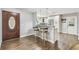 Bright kitchen with bar seating, stainless appliances, granite counters and stylish tile flooring at 7004 Westminster St, Tampa, FL 33635