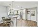 Bright kitchen featuring an island with barstool seating and stainless-steel appliances at 7004 Westminster St, Tampa, FL 33635