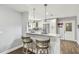 Bright kitchen featuring an island with barstool seating and stainless-steel appliances at 7004 Westminster St, Tampa, FL 33635