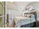 Cozy main bedroom showcasing unique decor, creating a warm and inviting atmosphere, features private ensuite at 7004 Westminster St, Tampa, FL 33635