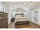 Stylish main bedroom features hardwood floors, contemporary decor, a tranquil atmosphere, and French doors at 7004 Westminster St, Tampa, FL 33635
