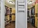 Spacious walk-in closet with custom shelving, providing ample storage for clothing and accessories organization at 7004 Westminster St, Tampa, FL 33635