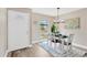 Cozy dining room with modern lighting, complementary decor, and a view of the outdoors at 7208 S Juanita St, Tampa, FL 33616