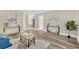 Spacious living room with modern decor, neutral paint, and wood-look flooring at 7208 S Juanita St, Tampa, FL 33616