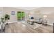Comfortable living room with sliding doors to the balcony and modern neutral decor at 7208 S Juanita St, Tampa, FL 33616