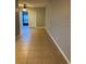 Open living room featuring tile floors, neutral paint, and ample natural light creating an inviting atmosphere at 7601 W Deleon Ct, Tampa, FL 33615