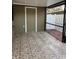 Large tiled patio area with screen enclosure and a door to the house for comfortable indoor/outdoor living at 7601 W Deleon Ct, Tampa, FL 33615