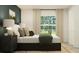 Serene bedroom with a comfortable bed, stylish furnishings, and plenty of natural light at 7754 Painted Sky Pl, Land O Lakes, FL 34637