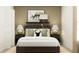 Comfortable bedroom showcasing a well-made bed with decorative pillows and stylish bedside lamps at 7754 Painted Sky Pl, Land O Lakes, FL 34637