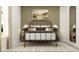 Inviting bedroom with a rustic metal frame bed, neutral walls, and ample natural light at 7754 Painted Sky Pl, Land O Lakes, FL 34637