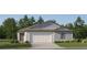 Charming single-Gathering home with a two-car garage and beautiful, low-maintenance landscaping at 7754 Painted Sky Pl, Land O Lakes, FL 34637
