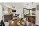 Cozy living room with a dining area featuring a fireplace and access to the kitchen at 8001 Pagoda Dr, Spring Hill, FL 34606