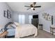 Bedroom with ceiling fan, cozy bed, and decorative wall art at 8007 Bally Money Rd, Tampa, FL 33610