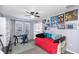 Bedroom with posters, desk, and a window for natural light, creating a unique space at 8007 Bally Money Rd, Tampa, FL 33610