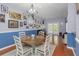 Inviting dining room featuring wood floors and white accents at 8007 Bally Money Rd, Tampa, FL 33610