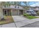 Desirable townhome with attached garage, driveway, and neutral exterior, showcasing its curb appeal at 8007 Bally Money Rd, Tampa, FL 33610