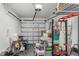 A clean, organized garage space with a white door and overhead storage racks at 8007 Bally Money Rd, Tampa, FL 33610