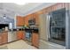 Modern kitchen featuring stainless steel appliances, granite countertops, and wooden cabinets at 8007 Bally Money Rd, Tampa, FL 33610