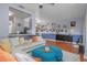 Spacious living room connected to kitchen and dining areas, with hardwood flooring at 8007 Bally Money Rd, Tampa, FL 33610