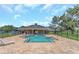 Community pool and clubhouse surrounded by lush greenery, perfect for relaxation at 8007 Bally Money Rd, Tampa, FL 33610