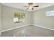 Bright bedroom with large window and a neutral color scheme at 8314 Stillbrook Ave, Tampa, FL 33615
