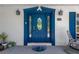 Close-up of a stylish blue front door with glass panels and decorative trim at 8314 Stillbrook Ave, Tampa, FL 33615