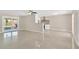 Bright living room features polished concrete floors and sliding glass doors to the backyard at 8314 Stillbrook Ave, Tampa, FL 33615