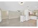 Open-concept living room flows into a modern kitchen with granite countertops at 8314 Stillbrook Ave, Tampa, FL 33615
