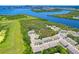 Scenic aerial view of community near the bay with beautiful waterways, lush trees and manicured lawns at 842 Tennyson Mill Cir, Tampa, FL 33619