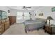 Bedroom with ceiling fan, ample natural light, and traditional furnishings at 842 Tennyson Mill Cir, Tampa, FL 33619