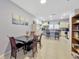 Open-concept dining area adjacent to kitchen with a sleek table, chairs, and views at 842 Tennyson Mill Cir, Tampa, FL 33619