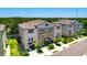Charming exterior view of a three-story townhome with manicured landscaping and private garages at 842 Tennyson Mill Cir, Tampa, FL 33619
