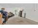 A garage is filled with storage and furniture and provides access to the backyard at 842 Tennyson Mill Cir, Tampa, FL 33619