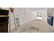Spacious garage with white block walls, an open door, and ample room for parking and storage at 842 Tennyson Mill Cir, Tampa, FL 33619
