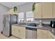 Bright kitchen featuring stainless steel appliances, granite countertops, and decor accents at 842 Tennyson Mill Cir, Tampa, FL 33619