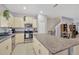 Kitchen with island offering generous counter space, stainless steel appliances, and eat-in dining at 842 Tennyson Mill Cir, Tampa, FL 33619