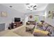 Inviting living room featuring a ceiling fan, a window, and comfortable seating at 842 Tennyson Mill Cir, Tampa, FL 33619