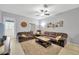Cozy living room with tile floors, a ceiling fan, and comfortable seating arrangement at 842 Tennyson Mill Cir, Tampa, FL 33619