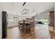Bright, modern kitchen with white cabinets, stainless steel appliances, and an island with bar seating at 9084 Quail Creek Dr, Tampa, FL 33647