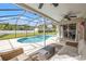 Inviting outdoor patio featuring a screened pool, comfortable seating, and a relaxing atmosphere at 9084 Quail Creek Dr, Tampa, FL 33647