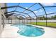 Beautiful pool with a screened-in enclosure and a spacious backyard, perfect for enjoying outdoor activities at 9084 Quail Creek Dr, Tampa, FL 33647