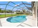 Sparkling screened-in pool with ample deck space, perfect for outdoor entertaining and relaxation at 9084 Quail Creek Dr, Tampa, FL 33647